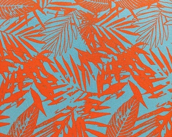 Viscose jersey fabric tropical leaves, orange turquoise