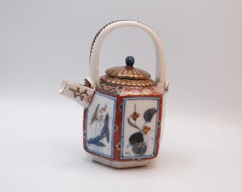Antique Japanese Imari porcelain teapot, hexagonal form in the Arita export tradition, with a fixed overhead porcelain handle.