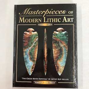 May include: A book titled "Masterpieces of Modern Lithic Art, Volume 1, 2014." The cover features three lithic art pieces in shades of green, brown, and blue against a black background. The text "The Green River Dovetail" and "Simply the Best" are also visible.