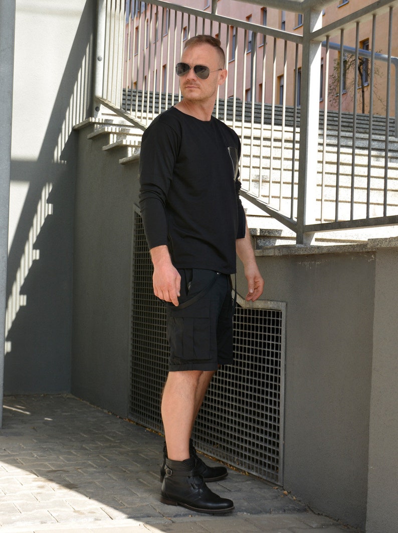 black sweatshirt with zip pocket and zippered cuff