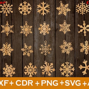 May include: Twenty-four laser cut snowflake designs for crafting projects. The snowflakes are arranged in six rows of four on a wood background. The snowflakes are all different designs and sizes.