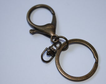 Ring mit Karabiner + Wirbel - Schlüsselring altmessing Karabinerhaken Schlüsselbänder (EUR 2,95/St.) Union-Knopf messing antik RESTmenge