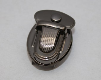 Steckverschluss schwarz-silber 34x24 mm (EUR 2,20/St.) Mappenschloss Steckschloss Verschluss