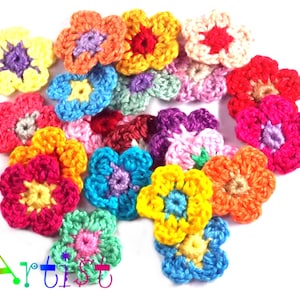 May include: A collection of colorful, crocheted flower appliques in various shades of yellow, orange, red, pink, blue, green, and purple. The flowers have a layered design with contrasting center colors. The image includes the text "Home Artist".