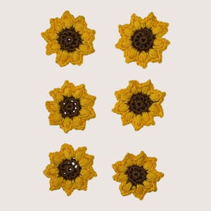 May include: Six individual sunflower-shaped crochet appliqués arranged in two columns. Each piece features a dark brown circular centre surrounded by bright yellow textured petals, crafted with a distinct yarn stitch pattern for a floral look.