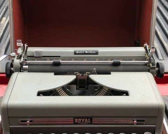 1955 Banana Yellow Royal Quiet Deluxe portable typewriter with case.