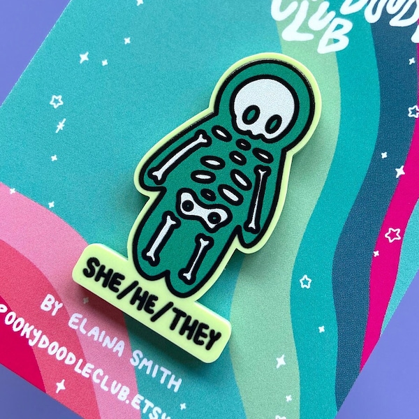 SHE/HE/THEY Pronoun Skeleton Acrylic Pin, Gender Identity Pride Gift by Spooky Doodle Club (2 inch)