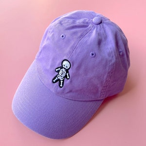 SKELETON HAT - Spooky Doodle Club Lilac Embroidered Dad Hat Baseball Cap