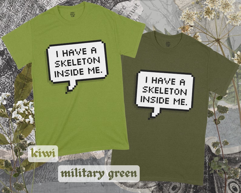 May include: Two t-shirts, one in kiwi green and one in military green, both featuring a pixelated speech bubble with the text "I have a skeleton inside me."