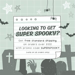 May include: A handwritten note on a lined paper background with a spooky Halloween theme. The note says "Looking to get super spooky? Get free standard shipping on orders over $100 with promo code SUPERSPOOKY. (valid on US orders only)"