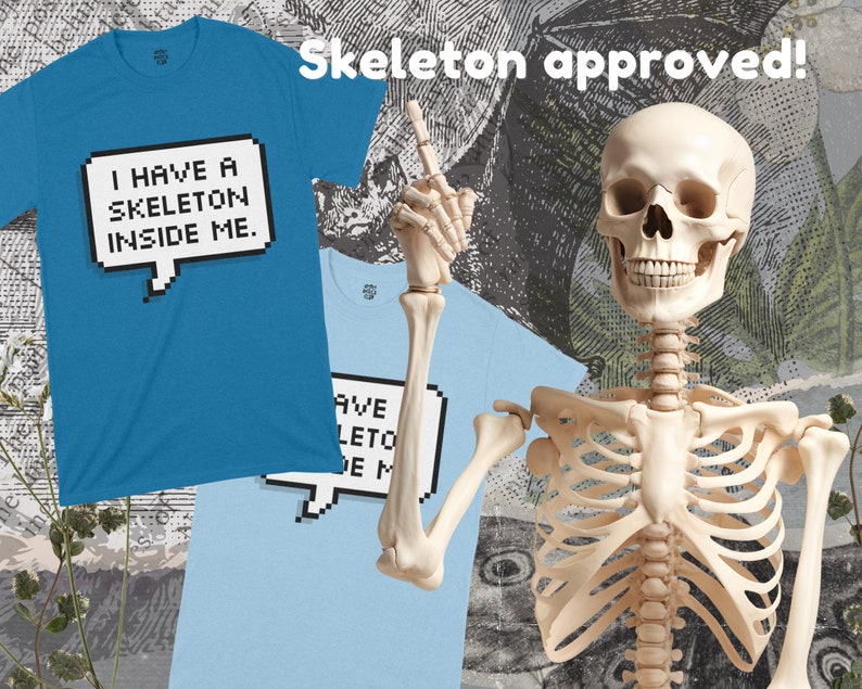 May include: A blue t-shirt with the text "I have a skeleton inside me." in a pixelated speech bubble. A skeleton with a friendly expression is giving a thumbs up. The text "Skeleton approved!" is above the skeleton.
