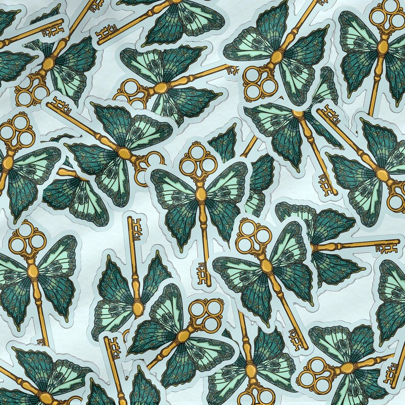 May include: A collection of stickers featuring a gold key with butterfly wings. The wings are a teal and green color with a detailed pattern. The stickers are on a white background.