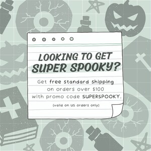 May include: A handwritten note on lined paper with a spooky Halloween theme. The note says "Looking to get super spooky? Get free standard shipping on orders over $100 with promo code SUPERSPOOKY. (valid on US orders only)"