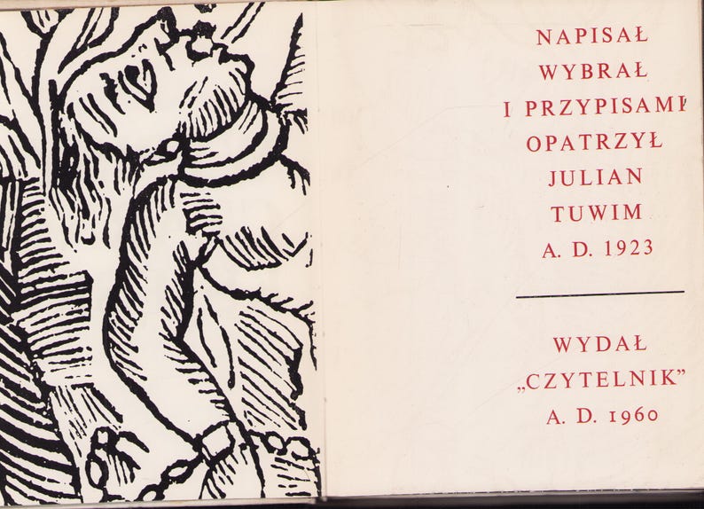 May include: An open book with a black and white illustration on the left page and text on the right. The illustration depicts a figure with a detailed, stylized design. The right page features Polish text in red, including the author's name and publication details.