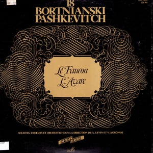 May include: A black vinyl record sleeve featuring gold text reading 18 BORTNIANSKI PASHKEVITCH and Le Faucon L'Avare. The design includes an intricate gold filigree border surrounding a central gold rectangle, with further text printed at the bottom.