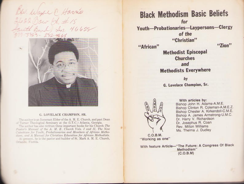 May include: An open book with text and a black and white photo of G. Lovelace Champion, Sr. The text includes "Black Methodism Basic Beliefs" and the names of contributors. The book is on a white background.
