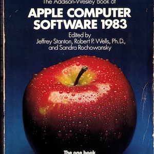 May include: Vintage book cover for "APPLE COMPUTER SOFTWARE 1983" by Addison-Wesley. The cover features a glossy red apple with water droplets, set against a dark blue background. The book's title and author details are in white text.