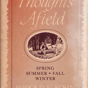 May include: Vintage book cover titled "Thoughts Afield" with an illustration of a person in a forest. The cover is in shades of brown and red, with the author's name and seasonal references.