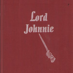 May include: A vintage book cover in a deep red hue. The title "Lord Johnnie" is printed in a white, elegant font. A white illustration of a sword is featured below the title, adding a touch of historical flair.