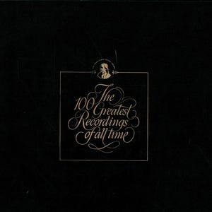 May include: A black album cover with the title "100 Greatest Recordings of all time" in elegant, cursive gold lettering. The cover also features a small illustration and text at the top. The background is a textured black.