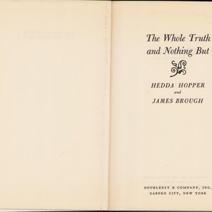 May include: Open book with the title "The Whole Truth and Nothing But" by Hedda Hopper and James Brough. The book's cover is a light beige color with black text. The publisher is Doubleday & Company, Inc., Garden City, New York.