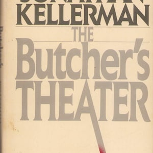 May include: A book cover with a cream background featuring the text JONATHAN KELLERMAN and THE BUTCHER'S THEATER in large gray serif font. A thin, sharp, red-tipped blade graphic extends downward from the word THEATER, and a small torn corner is visible.