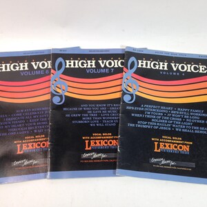 May include: Three vintage songbooks titled "Solos for High Voice" with volumes 4, 7, and 8. The covers are black with a treble clef and orange, red, and yellow stripes. Each book lists song titles and the Lexicon Performance Tracks logo.