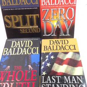 May include: Four hardcover books by David Baldacci are displayed. The titles include "Split Second", "Zero Day", "The Whole Truth", and "Last Man Standing". Each book cover features bold text and varying color schemes, with the author's name prominently displayed.