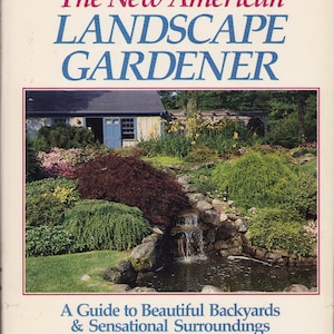 May include: A book titled The New American LANDSCAPE GARDENER: A Guide to Beautiful Backyards & Sensational Surroundings by Phebe Leighton and Calvin Simonds. The cover features a photograph of a garden with a small waterfall and a house.