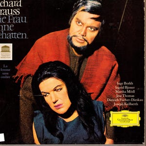 May include: Album cover featuring two people, a man and a woman, with text in German and French. The man wears a red shawl, and the woman is in a blue dress. The album is titled "Die Frau ohne Schatten."
