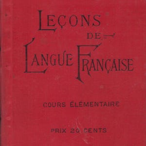May include: A vintage red book titled "Leçons de Langue Française" with black lettering. The cover includes decorative black borders and text indicating "Cours Élémentaire".