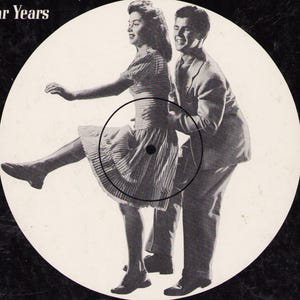 May include: Black and white image of a vintage vinyl record featuring a couple dancing. The woman is wearing a striped dress, and the man is in a suit. The record label has the words "Star Years" at the top.