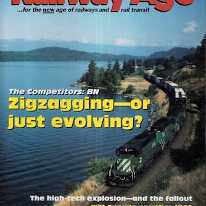 May include: The September 1994 issue of Railway Age magazine features a green freight train traveling along a track beside a large lake. The cover text includes "Railway Age," "The Competitors: BN Zigzagging—or just evolving?" and other headlines.