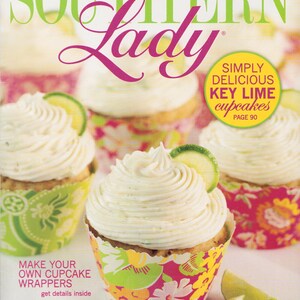 May include: The July/August 2011 issue of Southern Lady magazine features the text 150 Ways to Celebrate Summer and Simply Delicious Key Lime Cupcakes Page 90. The cover displays cupcakes with white frosting, lime slices, and floral wrappers.