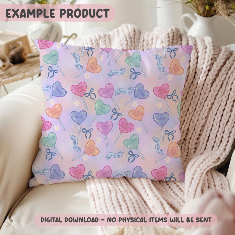 May include: Square pillow with a repeating pattern of heart-shaped lollipops in various colors, each with a different message. The background is a soft gradient of pink and purple. The text "EXAMPLE PRODUCT" is at the top.