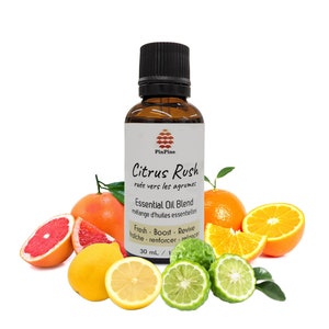 May include: A 30 ml bottle of Citrus Rush essential oil blend with a white label that says "Citrus Rush" and "ruée vers les agrume" in French. The bottle is surrounded by citrus fruits, including oranges, grapefruits, lemons, and limes.