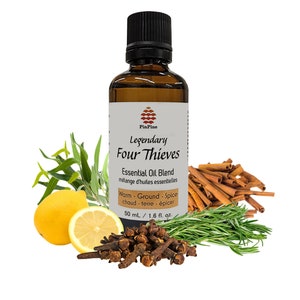 May include: A brown glass bottle with a white label that reads "PinPine Legendary Four Thieves Essential Oil Blend mélange d'huiles essentielles Warm Ground Spice chaud terre épicer 50 ml / 1.6 fl. oz". The bottle is surrounded by sprigs of rosemary, cinnamon sticks, cloves, and lemon slices.