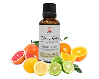 May include: A 30 ml bottle of Citrus Rush essential oil blend with a white label that says "Citrus Rush" and "ruée vers les agrume" in French. The bottle is surrounded by citrus fruits, including oranges, grapefruits, lemons, and limes.
