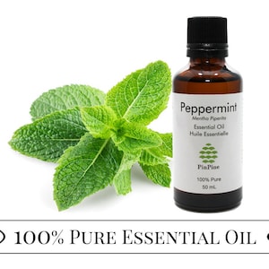 May include: A 50 ml bottle of 100% pure peppermint essential oil with a green leaf sprig in the background. The bottle label reads "Peppermint Mentha Piperita Essential Oil Huile Essentielle PinPine 100% Pure 50 ml".