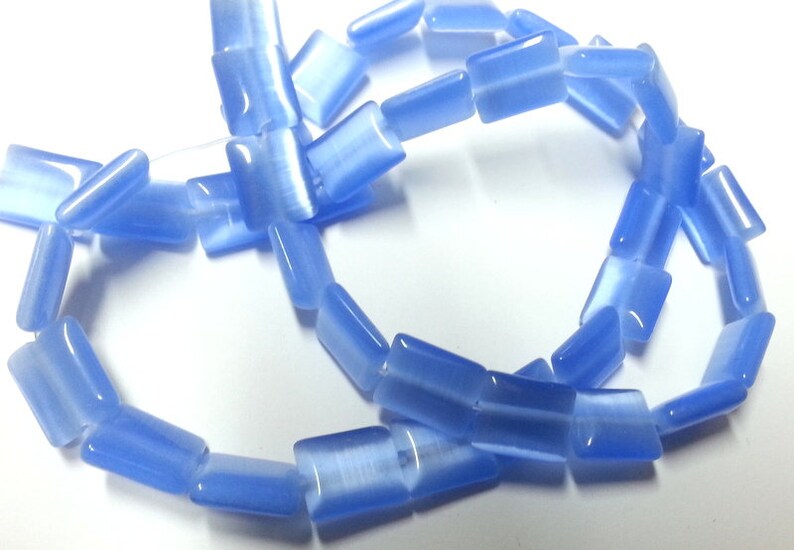 Reduces 39 blue rectangular flat glass beads