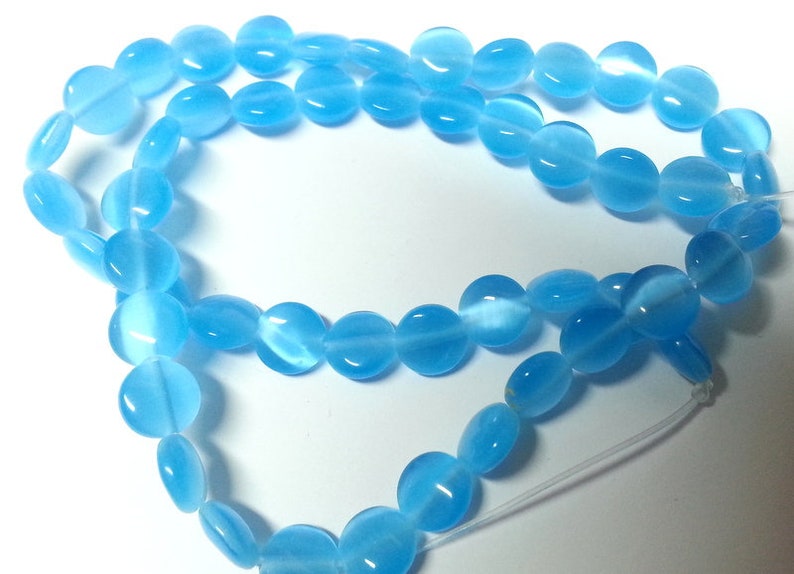 Reduces 39 blue rectangular flat glass beads