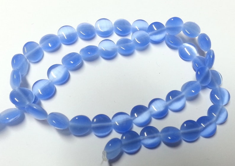 Reduces 39 blue rectangular flat glass beads