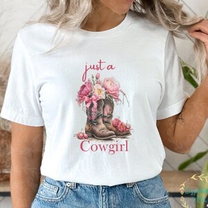 Coquette Just a Cowgirl Unisex Jersey Short Sleeve tee | Cowgirl Hat & Boots Shirt | Western Graphic tee | Oversized Tee | Coquette Shirt