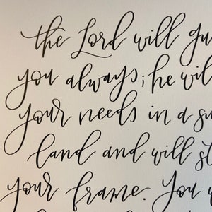 May include: Black and white calligraphy on a white background with the text "the Lord will guide you always; he will supply your needs in a season of plenty and will strengthen your frame. You are his"
