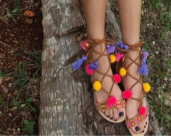 Boho chic gladiator sandals with pompoms