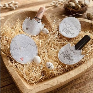 May include: A white ceramic mug with a black handle and the text "But First, Coffee" in a black, bold font. The mug is on a white surface. The mug is 4 inches tall.