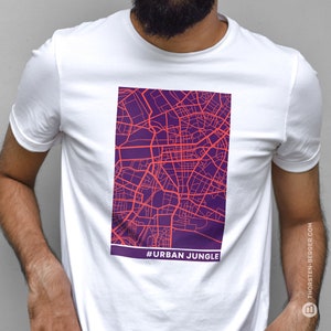 May include: White t-shirt with a purple and red city map graphic and the text "#URBAN JUNGLE" printed on the front.