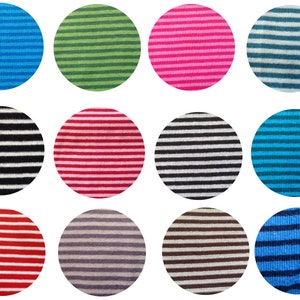 May include: Twelve different striped fabric swatches in various colors, including blue, green, pink, black, white, red, and gray.