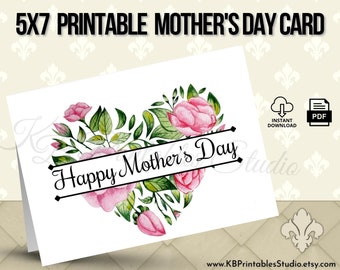 May include: Printable 5x7 Mother's Day card featuring a heart-shaped arrangement of pink watercolor flowers and green leaves with the text "Happy Mother's Day".