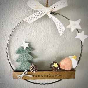 Metal ring with hand-felted Christmas snail and winter decoration